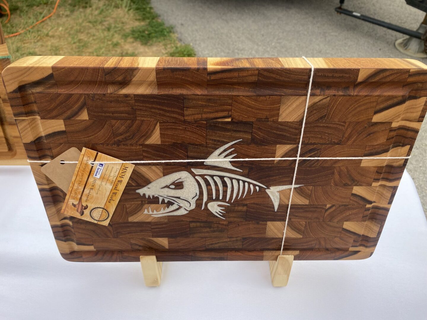 Wooden cutting board with fish skeleton design.