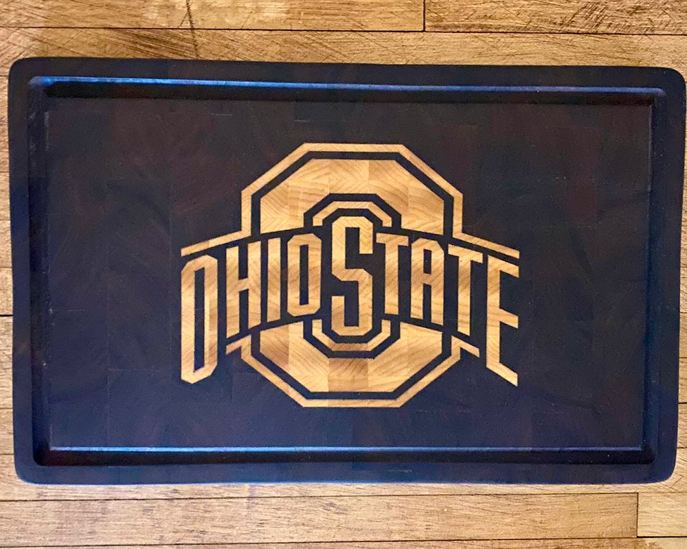 Ohio State logo on wooden cutting board.